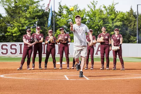 STARKVILLE, MS - April 23, 2022 - Mississippi State Head Coach Mike Leach throwing the first pitch before the game between the Auburn Tigers and the Mississippi State Bulldogs at Nusz Park in Starkville, MS. Photo By Laura Parsley