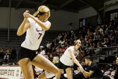 STARKVILLE, MS - November 26, 2022 - Mississippi State Right Setter Caylee Sharkey (#9) and Mississippi State Middle Blocker Rebecca Walk (#7) during the match between the Missouri Tigers and the Mississippi State Bulldogs at the Newell-Grissom Building in Starkville, MS. Photo By Mike Mattina