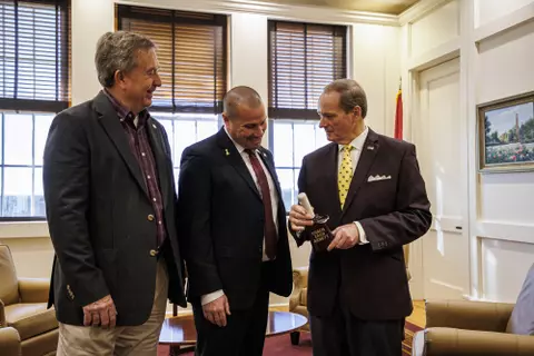STARKVILLE, MS - December 15, 2022 - Mississippi State Interim Athletic Director and Senior Deputy Athletic Director of Compliance Bracky Brett, Mississippi State Head Coach Zach Arnett and Mississippi State President Dr. Mark Keenum during a meeting in the President’s Office at Lee Hall at Mississippi State University in Starkville, MS. Photo By Kevin Snyder