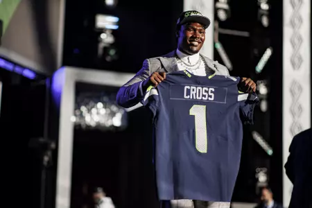 LAS VEGAS, NV - April 28, 2022 - Mississippi State Offensive Lineman Charles Cross holds up his jersey after being drafted 9th overall in the 2022 NFL Draft at Caesars Forum in Las Vegas, NV. Photo By Austin Perryman