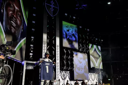 LAS VEGAS, NV - April 28, 2022 - Mississippi State Offensive Lineman Charles Cross holds up his jersey after being drafted 9th overall in the 2022 NFL Draft at Caesars Forum in Las Vegas, NV. Photo By Austin Perryman