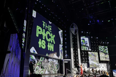 LAS VEGAS, NV - April 28, 2022 - Seattle Seahawks graphics are shown on stage for the 9th overall pick of the 2022 NFL Draft at Caesars Forum in Las Vegas, NV. Photo By Austin Perryman