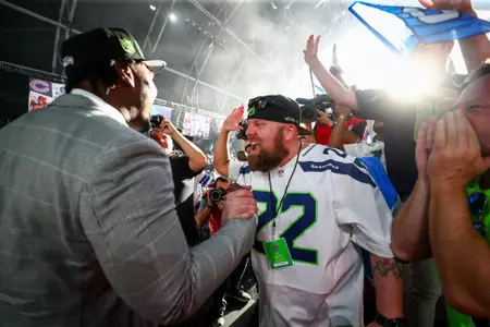 Mississippi State offensive lineman Charles Cross embraces a Seattle Seahawks fan during the 2022 NFL Draft on Thursday, April 28, 2022 in Las Vegas. (Kevin Sabitus/NFL)