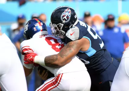 Sep 11, 2022; Nashville, Tennessee, USA; New York Giants quarterback Daniel Jones (8) is sacked by Tennessee Titans defensive tackle Jeffery Simmons (98) during the first half at Nissan Stadium. Mandatory Credit: Christopher Hanewinckel-USA TODAY Sports