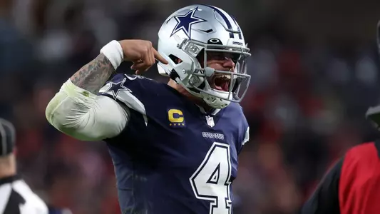 Jan 16, 2023; Tampa, Florida, USA; Dallas Cowboys quarterback Dak Prescott (4) reacts after throwing a touchdown pass against the Tampa Bay Buccaneers in the second half during the wild card game at Raymond James Stadium. Mandatory Credit: Kim Klement-USA TODAY Sports