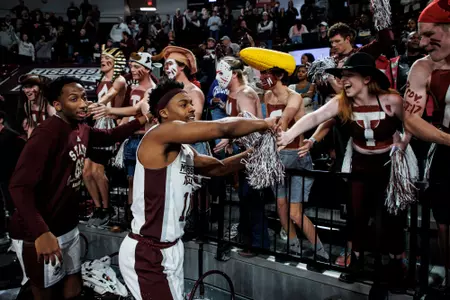 STARKVILLE, MS - January 28, 2023 - Mississippi State Fans and Mississippi State Guard Eric Reed Jr (#11) after the game between the TCU Horned Frogs and the Mississippi State Bulldogs at Humphrey Coliseum in Starkville, MS. Photo By Will Porada