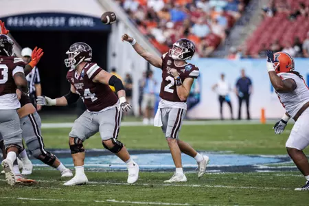 TAMPA, FL - January 02, 2023 - Mississippi State Quarterback Will Rogers (#2) and Mississippi State Steven Losoya III (#64) during the ReliaQuest Bowl between the Mississippi State Bulldogs and the Illinois Fighting Illini at Raymond James Stadium in Tampa, FL. Photo By Mitch Phillips