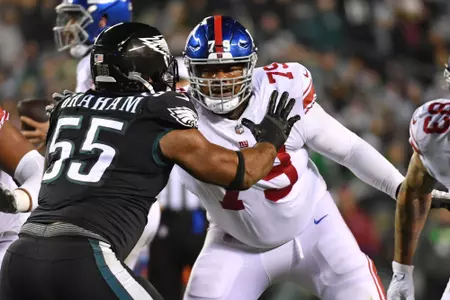 Jan 8, 2023; Philadelphia, Pennsylvania, USA; New York Giants guard Tyre Phillips (79) blocks against Philadelphia Eagles defensive end Brandon Graham (55) at Lincoln Financial Field. Mandatory Credit: Eric Hartline-USA TODAY Sports