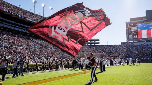 AUBURN, AL - November 13, 2021 - Cheerleader waves an MState flag during the game between the Mississippi State Bulldogs and the Auburn Tigers at Jordan-Hare Stadium in Auburn, AL. Photo By Austin Perryman