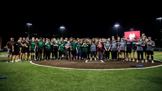 STARKVILLE, MS - October 27, 2023 - A Miracle League Baseball Player and The Mississippi State Bulldog during the Miracle League baseball game at Dudy Noble Field at Polk-Dement Stadium in Starkville, MS. Photo By Will Porada