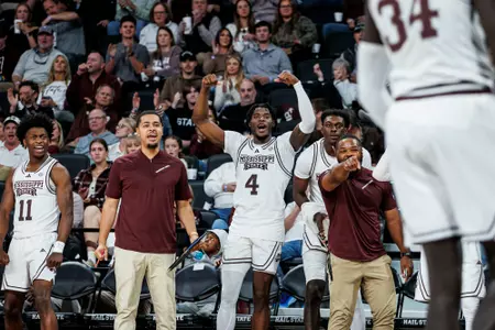 STARKVILLE, MS - November 24, 2023 - Mississippi State Guard Trey Fort (#11), Mississippi State Director of Basketball Operations Jovan Austin, Mississippi State Guard/Forward Cameron Matthews (#4) and Mississippi State Director of Recruiting Patrice Days during the game between the Nicholls Colonels and the Mississippi State Bulldogs at Humphrey Coliseum in Starkville, MS. Photo By Mike Mattina