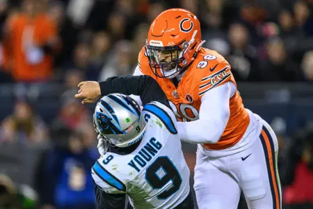 Nov 9, 2023; Chicago, Illinois, USA; Chicago Bears defensive end Montez Sweat (98) hits Carolina Panthers quarterback Bryce Young (9) in during the second quarter at Soldier Field. Mandatory Credit: Daniel Bartel-USA TODAY Sports