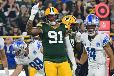 Sep 28, 2023; Green Bay, Wisconsin, USA; Green Bay Packers linebacker Preston Smith (91) reacts after making a tackle in the first quarter against the Detroit Lions at Lambeau Field. Mandatory Credit: Benny Sieu-USA TODAY Sports