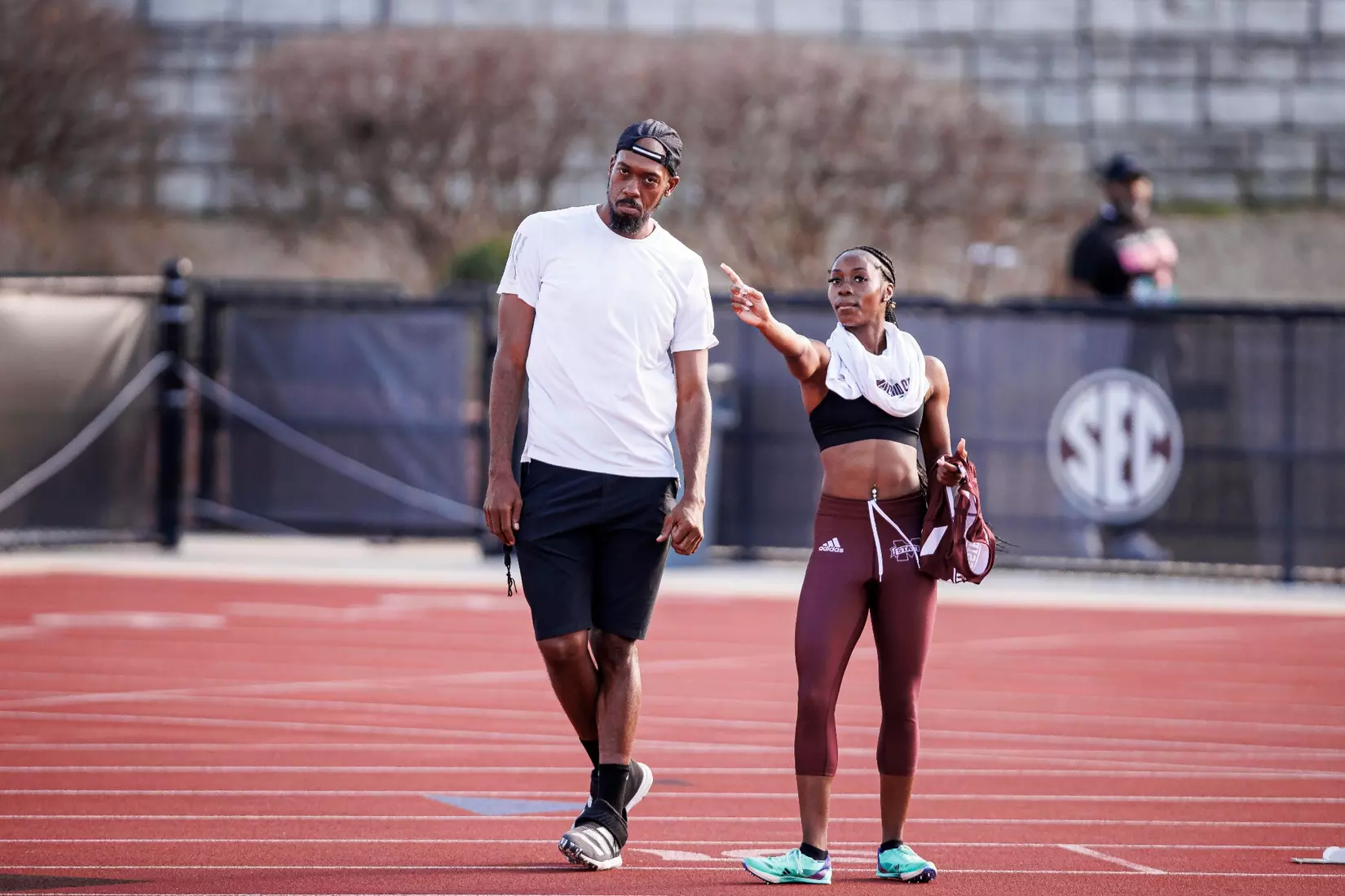 STARKVILLE, MS - March 24, 2023 - Mississippi State Assistant Track & Field Coach Carjay Lyles and Mississippi State Sprinter McKenzie Calloway during the Bulldog Relays at the Mike Sanders Track Complex in Starkville, MS. Photo By Mike Mattina