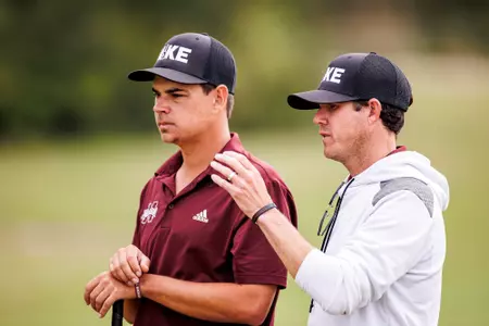 Ruan Pretorius and head coach Dusty Smith at the Mossy Oak Collegiate on April 4, 2023.