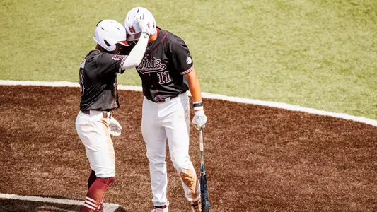 STARKVILLE, MS - May 07, 2023 - Mississippi State Infielder Amani Larry (#8) and Outfielder Kellum Clark (#11) during the game between the Arkansas Razorbacks and the Mississippi State Bulldogs at Dudy Noble Field at Polk-Dement Stadium in Starkville, MS. Photo By Laura Parsley