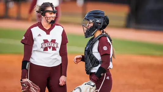 STARKVILLE, MS - March 11, 2023 - Mississippi State Pitcher Grace Fagan (#31) and Mississippi State Catcher/Infielder Riley Hull (#4) during the game between the Oklahoma Sooners and the Mississippi State Bulldogs at Nusz Park in Starkville, MS. Photo By Jaden Powell