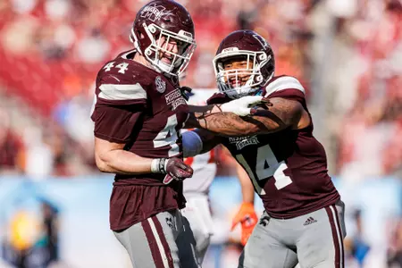 TAMPA, FL - January 02, 2023 - Mississippi State Linebacker Jett Johnson (#44) and Mississippi State Linebacker Nathaniel "Bookie" Watson (#14) during the ReliaQuest Bowl between the Mississippi State Bulldogs and the Illinois Fighting Illini at Raymond James Stadium in Tampa, FL. Photo By Kevin Snyder