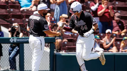 STARKVILLE, MS - May 07, 2023 - Mississippi State Infielder/Outfielder Hunter Hines (#44) and Baseball Camps Coordinator/Volunteer Assistant Kyle Cheesebrough during the game between the Arkansas Razorbacks and the Mississippi State Bulldogs at Dudy Noble Field at Polk-Dement Stadium in Starkville, MS. Photo By Laura Parsley