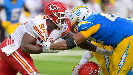 Sep 29, 2024; Inglewood, California, USA; Kansas City Chiefs defensive tackle Chris Jones (95) and Los Angeles Chargers center Sam Mustipher (62) battle at the line in the second half at SoFi Stadium. Mandatory Credit: Jayne Kamin-Oncea-Imagn Images