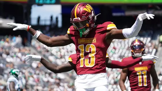 Aug 10, 2024; East Rutherford, New Jersey, USA; Washington Commanders cornerback Emmanuel Forbes (13) celebrates after breaking up a pass to New York Jets wide receiver Mike Williams (18) during the first quarter at MetLife Stadium. Mandatory Credit: Lucas Boland-USA TODAY Sports