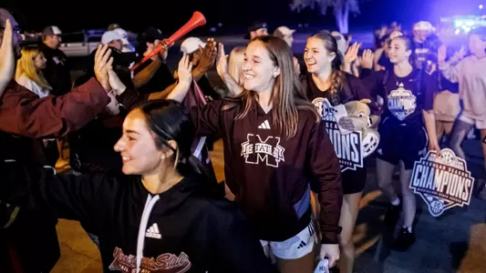 STARKVILLE, MS - October 27, 2024 - Mississippi State Midfielder Ellie Pitts (#6) and Mississippi State Forward Maggie Wadsworth (#21) during soccer arrival after winning the 2024 SEC Regular Season Championship at the George M. Bryan Airport in Starkville, MS. Photo By Mike Mattina