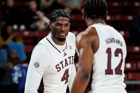 STARKVILLE, MS - November 12, 2024 - Mississippi State Guard Josh Hubbard (#12) and Mississippi State Guard/Forward Cameron Matthews (#4) during the game between the SLU Lions and the Mississippi State Bulldogs at Humphrey Coliseum in Starkville, MS. Photo By Will Porada