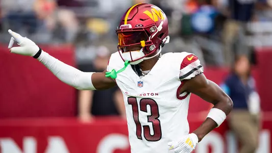Sep 29, 2024; Glendale, Arizona, USA; Washington Commanders cornerback Emmanuel Forbes Jr. (13) against the Arizona Cardinals at State Farm Stadium. Mandatory Credit: Mark J. Rebilas-Imagn Images