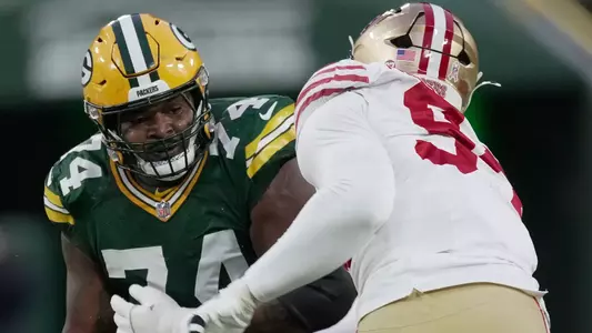 Green Bay Packers guard Elgton Jenkins (74) blocks San Francisco 49ers defensive end Yetur Gross-Matos (94) during the first quarter of their game Sunday, November 24, 2024 at Lambeau Field in Green Bay, Wisconsin.