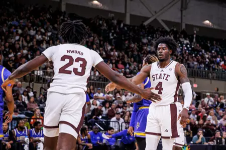 TUPELO, MS - December 14, 2024 - Mississippi State Center Michael Nwoko (#23) and Mississippi State Guard/Forward Cameron Matthews (#4) during the game between the McNeese State Cowboys and the Mississippi State Bulldogs at Cadence Bank Arena in Tupelo, MS. Photo By Mike Mattina