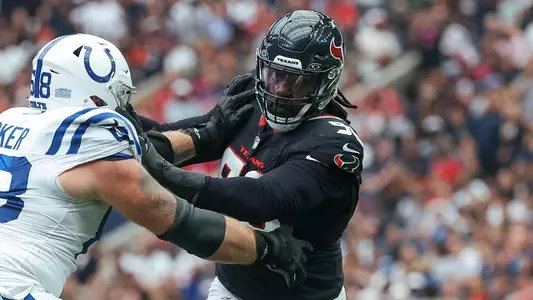 Oct 27, 2024; Houston, Texas, USA; Houston Texans defensive end Denico Autry (96) applies defensive pressure as Indianapolis Colts guard Dalton Tucker (68) defends during the game at NRG Stadium. Mandatory Credit: Troy Taormina-Imagn Images