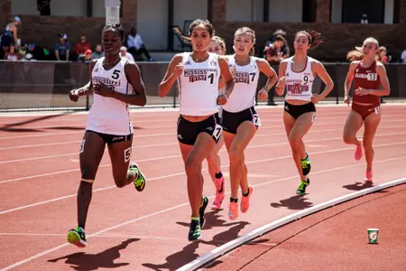 STARKVILLE, MS - March 25, 2023 - Mississippi State’s Middle Distance Runner Jimoh Ramat, Distance Runner Zoe Brito-Babapulle and Distance Runner Hayley Ogle during the Bulldog Relays at the Mike Sanders Track Complex in Starkville, MS. Photo By Laura Parsley