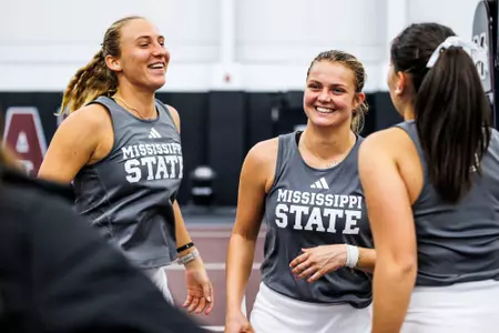 STARKVILLE, MS - February 18, 2024 - Mississippi State's Chloé Cirotte, Mississippi State's Alexandra Mikhailuk, and Mississippi State's Alessia Tagliente during the match between the Bellarmine Knights and the Mississippi State Bulldogs at the Rula Tennis Pavilion in Starkville, MS. Photo By Ivy Rose Ball