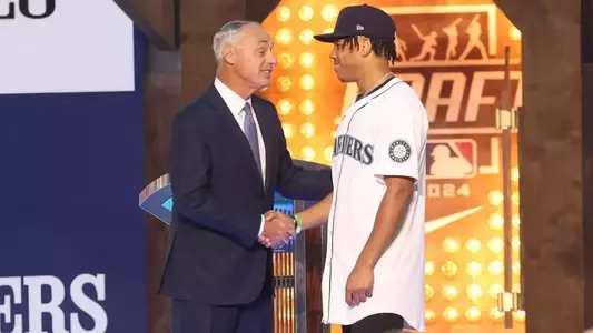 Jul 14, 2024; Ft. Worth, TX, USA;  MLB Commissioner Rob Manfred takes a photo with Jurrangelo Cijntje after being drafted by the Seattle Mariners with the 15th pick during the first round of the MLB Draft at Cowtown Coliseum. Mandatory Credit: Kevin Jairaj-USA TODAY Sports