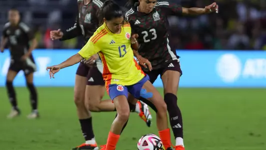 Apr 6, 2024; Orlando, FL, USA; Colombia midfielder Ilana Izquierdo (13) and Mexico forward Maricarmen Reyes (23) battle for the ball in the second half at Inter&Co Stadium. Mandatory Credit: Morgan Tencza-USA TODAY Sports