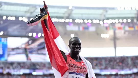 PARIS, FRANCE - AUGUST 10: Silver medalist Marco Arop of Team Canada celebrates after competing in the Men's 800m Final on day fifteen of the Olympic Games Paris 2024 at Stade de France on August 10, 2024 in Paris, France. (Photo by Hannah Peters/Getty Images)