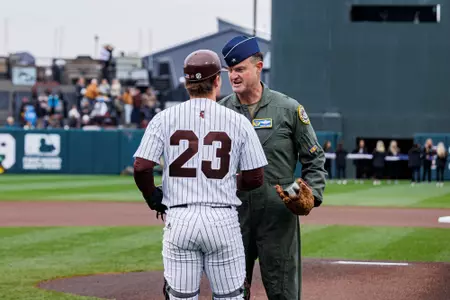 Jackson Owen STARKVILLE, MS - February 17, 2024 - Brigadier General Randall Cason and Mississippi State Catcher Jackson Owen (#23) during the game between the Air Force Falcon and the Mississippi State Bulldogs at Dudy Noble Field at Polk-Dement Stadium in Starkville, MS. Photo By Ivy Rose Ball