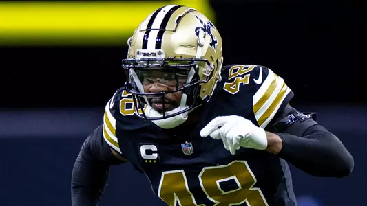 Dec 10, 2023; New Orleans, Louisiana, USA; New Orleans Saints safety J.T. Gray (48) rushes past Carolina Panthers safety Xavier Woods (25) on a kick return during the first half at the Caesars Superdome. Mandatory Credit: Stephen Lew-USA TODAY Sports