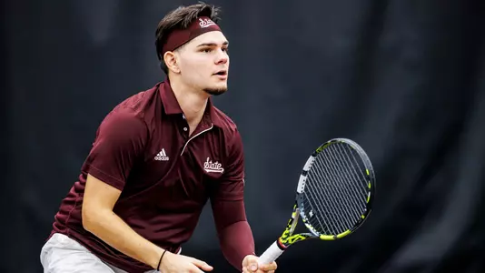 STARKVILLE, MS - January 19, 2025 - Mississippi State's Dusan Milanovic during the match between the Troy Trojans and the Mississippi State Bulldogs at the Rula Tennis Pavilion in Starkville, MS. Photo By Ivy Rose Ball