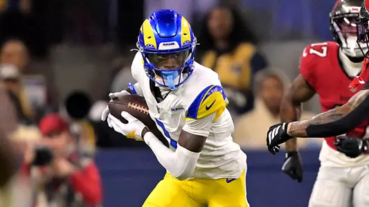 Nov 23, 2025; Inglewood, California, USA; Los Angeles Rams cornerback Emmanuel Forbes Jr. (1) runs the ball after an interception against the Tampa Bay Buccaneers at SoFi Stadium. Mandatory Credit: Jayne Kamin-Oncea-Imagn Images