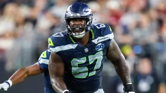 Sep 25, 2025; Glendale, Arizona, USA; Seattle Seahawks tackle Charles Cross (67) against the Arizona Cardinals at State Farm Stadium. Mandatory Credit: Mark J. Rebilas-Imagn Images