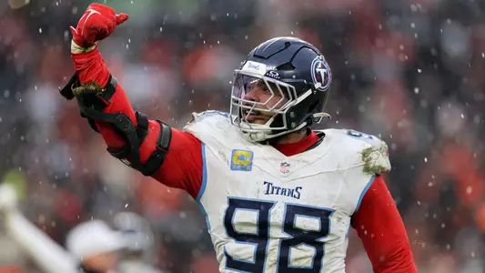 Dec 7, 2025; Cleveland, Ohio, USA; Tennessee Titans defensive tackle Jeffery Simmons (98) reacts after sacking Cleveland Browns quarterback Shedeur Sanders (not pictured) during the fourth quarter at Huntington Bank Field. Mandatory Credit: Scott Galvin-Imagn Images