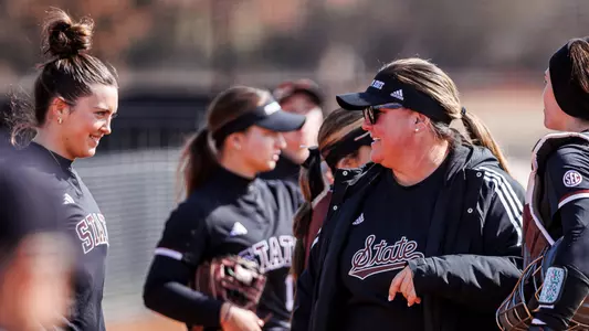HUNTSVILLE, AL - February 23, 2025 - Mississippi State Head Coach Samantha Ricketts and Mississippi State Outfielder Taylor Troutman (#41) during the game between the Jacksonville State Gamecocks and the Mississippi State Bulldogs during the Rocket City Softball Showcase at the UAH Softball Field in Huntsville, AL. Photo By Ivy Rose Ball