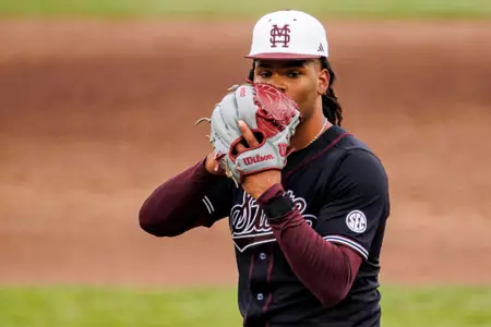 STARKVILLE, MS - February 16, 2025 - Mississippi State Pitcher Mikhai Grant (#4) during the game between the Manhattan Jaspers and the Mississippi State Bulldogs at Dudy Noble Field at Polk-Dement Stadium in Starkville, MS. Photo By Mike Mattina