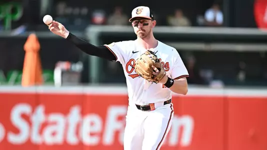 Jul 28, 2024; Baltimore, Maryland, USA; Baltimore Orioles third baseman Jordan Westburg (11) throws to first base during the ninth inning against the San Diego Padres at Oriole Park at Camden Yards. Mandatory Credit: James A. Pittman-USA TODAY Sports
