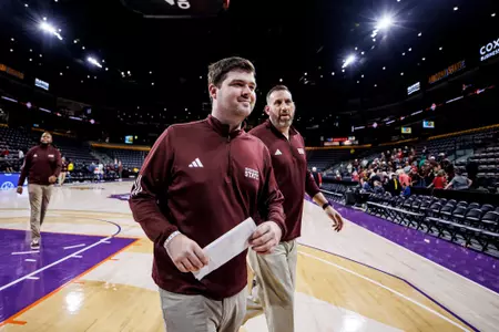 TEMPE, AZ - November 28, 2024 - Mississippi State Coordinator of Men's Basketball Operations Joe Rogers and Mississippi State's Assistant to the Head Coach Scott Padgett during the Arizona Tip-Off game between the UNLV Rebels and the Mississippi State Bulldogs at Mullett Arena in Tempe, AZ. Photo By Mike Mattina