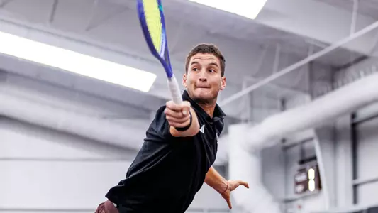 STARKVILLE, MS - February 23, 2026 - Mississippi State's Petar Jovanovic during the match between the Texas Longhorns and the Mississippi State Bulldogs at the Rula Tennis Pavilion in Starkville, MS. Photo By Mike Mattina