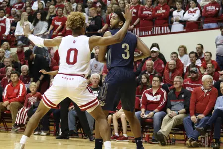 Tyler Hall guarded by Romeo Langford