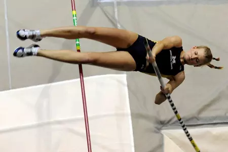 Ellie (Rudy) van Swearingen clears the bar