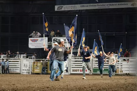 Bobcat Football Players Lead Rodeo Team into Arena